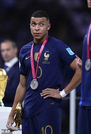 During the awards ceremony, Mbappe holds the Golden Boot, which is given to the player who scored the most goals in the tournament. 