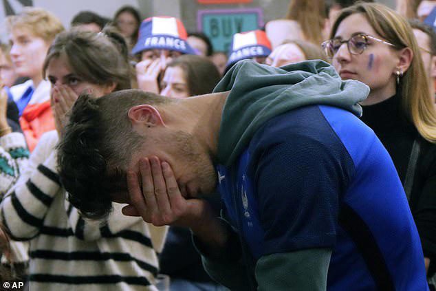 France football fans in Lille react to their team's loss to Argentina in the World Cup final