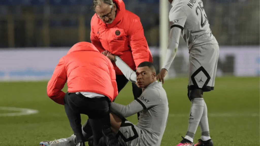 Kylian Mbappe is wounded during the French League One soccer match between Montpellier and Paris Saint-Germain at the State La Mosson stadium in Montpellier, France, Wednesday, Feb. 1, 2023.