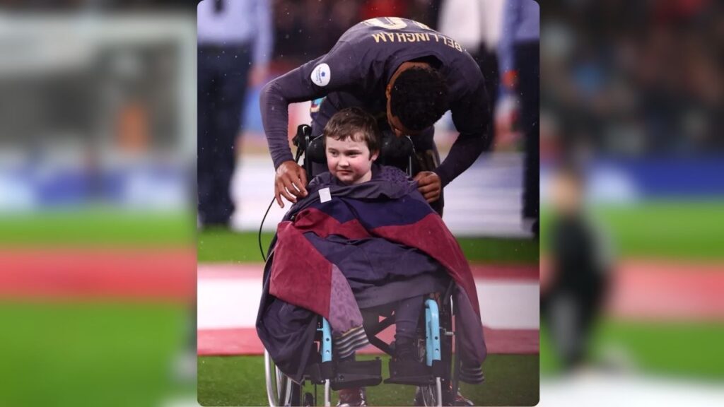 The English star let the young fan wear his tracksuit top to stay warm and dry.
