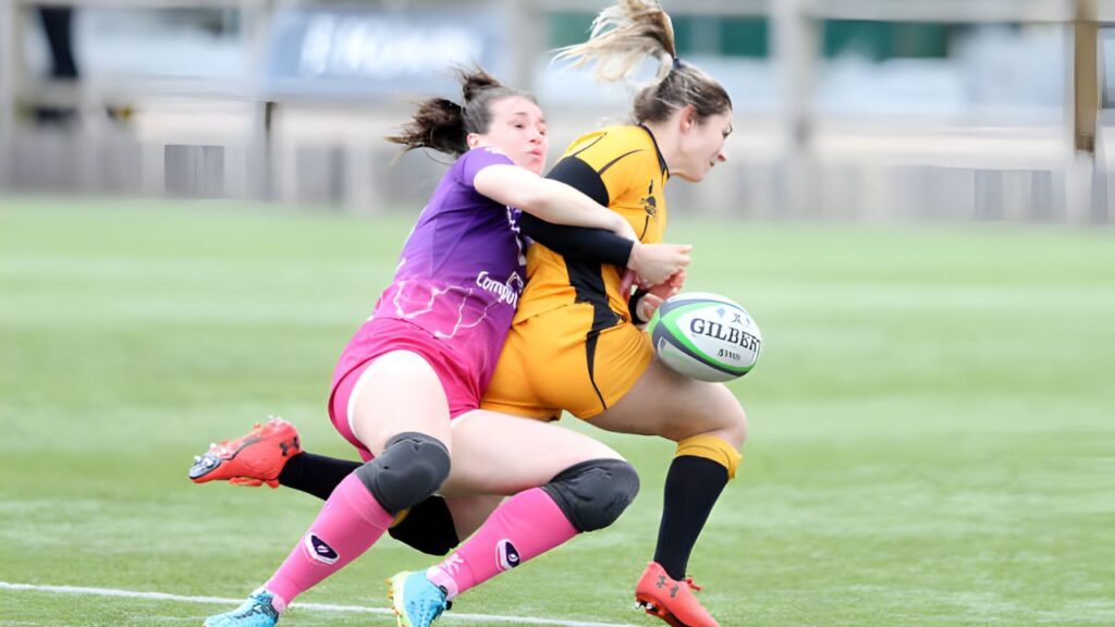 Emily Scarratt of Loughborough Lightning tackles Amy Wilson Hardy of Wasps during the Loughborough Lightning vs. Wasps Rugby Allianz Premier 15s match at Loughborough University Stadium on March 20, 2021. Photo by Morgan Harlow/Getty Images)