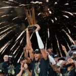 Giannis Antetokounmpo celebrating after being named MVP following the Bucks' NBA Cup victory.