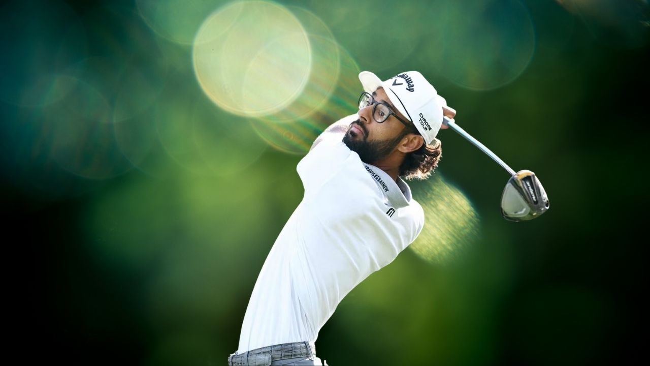 A young golfer looking disappointed on the course, having withdrawn from the Valspar Championship.